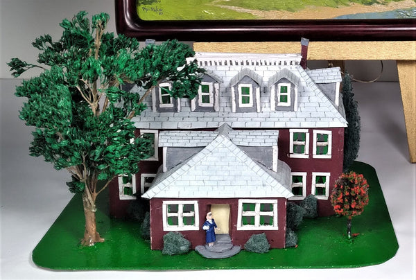A scratch built maquette of a red house used in the Landscape oil painting 'Red House', by Phil Fake